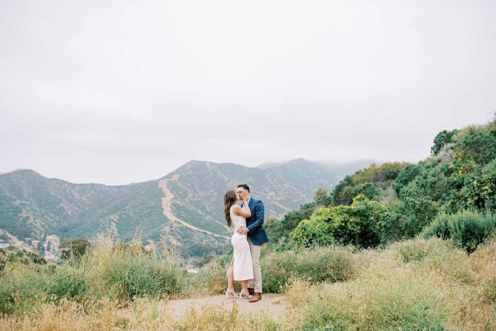 In the interior of the island a couple kiss at Catalina island elopement in may by Catalina island elopement photographer Austyn Elizabeth Photography