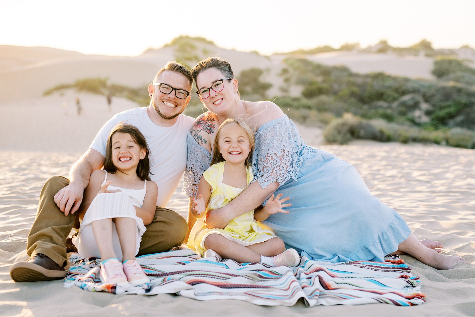 Family smiling so hard at the Oceano Dunes in Pismo Beach by Pismo Beach Family Photographer Austyn Elizabeth Photography