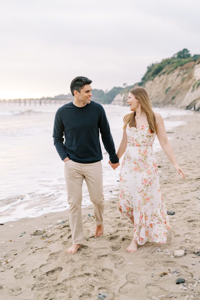 Walking along the sand at the Ritz Carlton Bacara photographed by Santa Barbara wedding photographer Austyn Elizabeth Photography