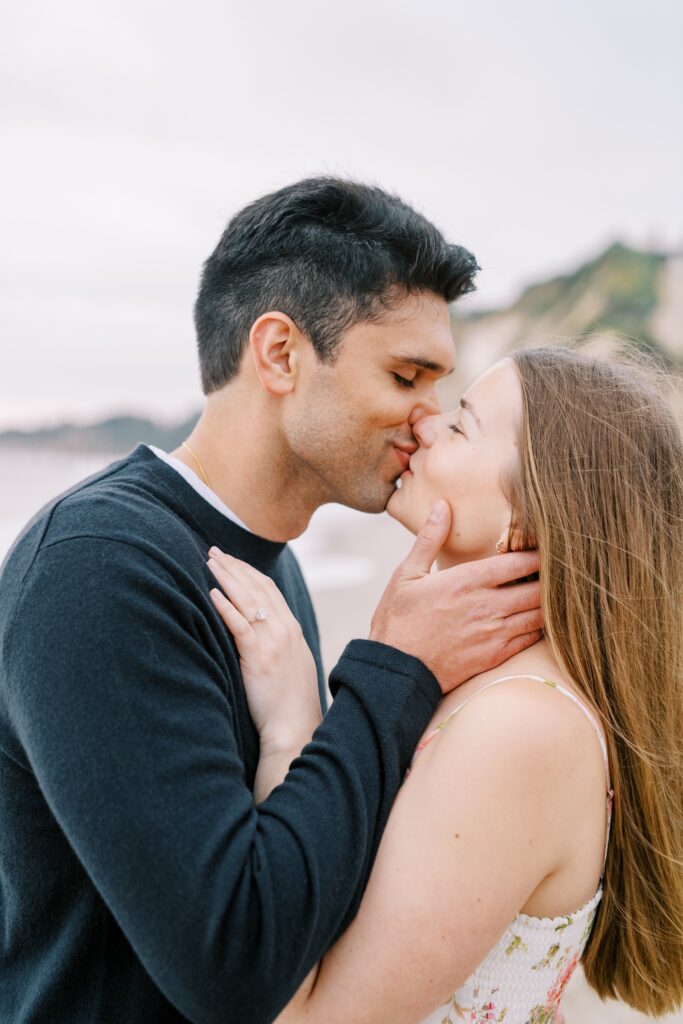 guy pulls girl in to kiss her at the Ritz Carlton Bacara photographed by Santa Barbara wedding photographer Austyn Elizabeth Photography