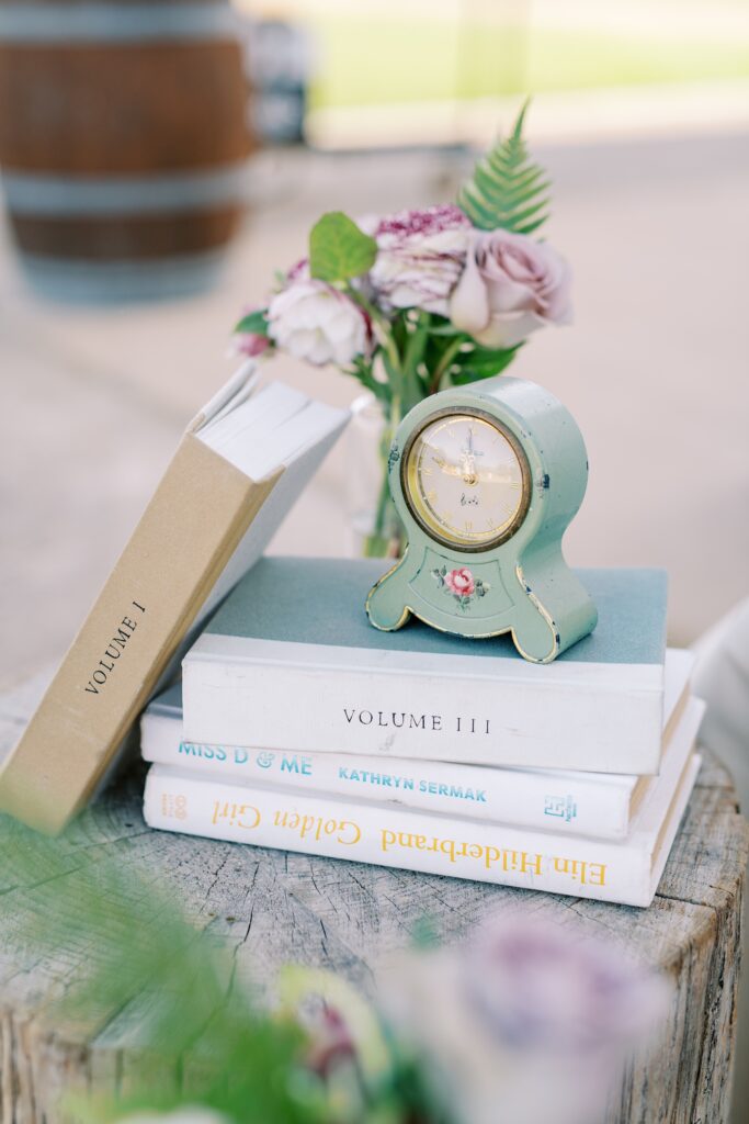 Books and clock at Cal Poly's EIM event designed by Brooke Nichole Events at The White Barn by San Luis Obispo Wedding Photographer Austyn Elizabeth Photography