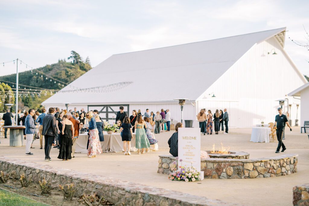 Guests mingle at Cal Poly's EIM event designed by Brooke Nichole Events at The White Barn by San Luis Obispo Wedding Photographer Austyn Elizabeth Photography