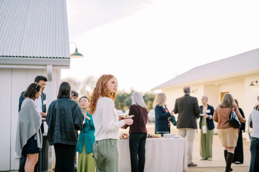 Guests mingle during cocktail hour at Cal Poly's EIM event at The White Barn by San Luis Obispo Wedding Photographer Austyn Elizabeth Photography