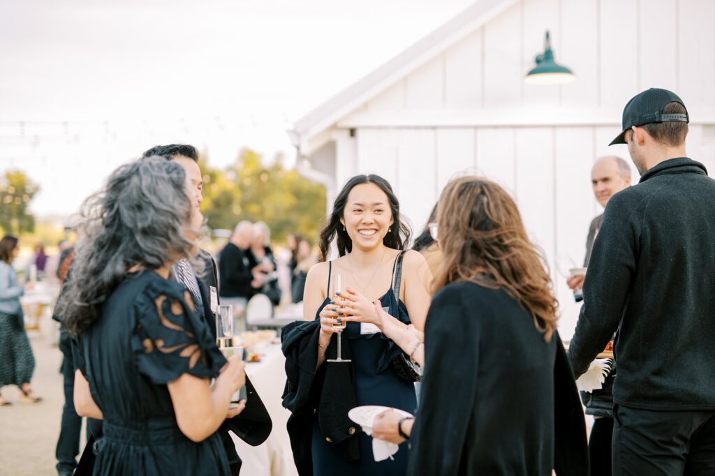 Guest mingle outside White Barn at Cal Poly's EIM event at The White Barn by San Luis Obispo Wedding Photographer Austyn Elizabeth Photography
