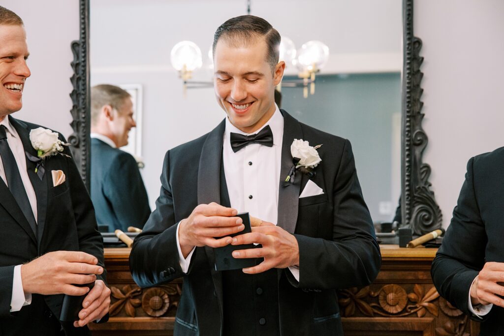 Groom laughs at Lamoure Vineyard wedding at Le Reve Estate by Pismo Beach wedding photographer Austyn Elizabeth Photography