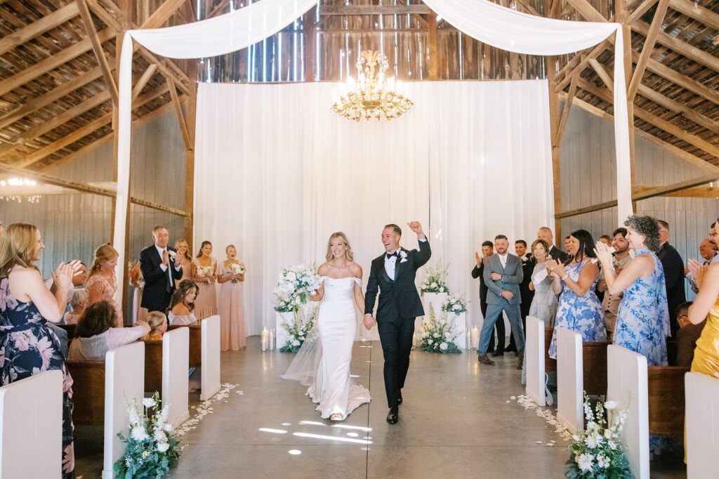 Walking down the aisle at the barn at Lamoure Vineyard wedding by Pismo Beach wedding photographer Austyn Elizabeth Photography