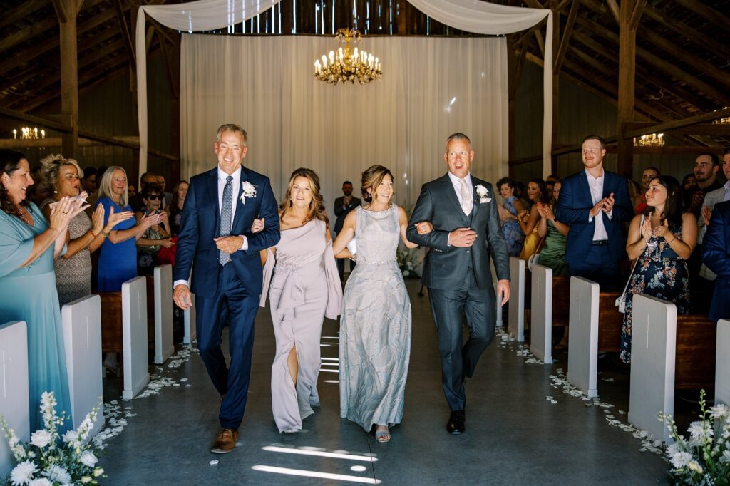 Parents walk arm and arm after their kids got married at Lamoure Vineyard wedding by Pismo Beach wedding photographer Austyn Elizabeth Photography