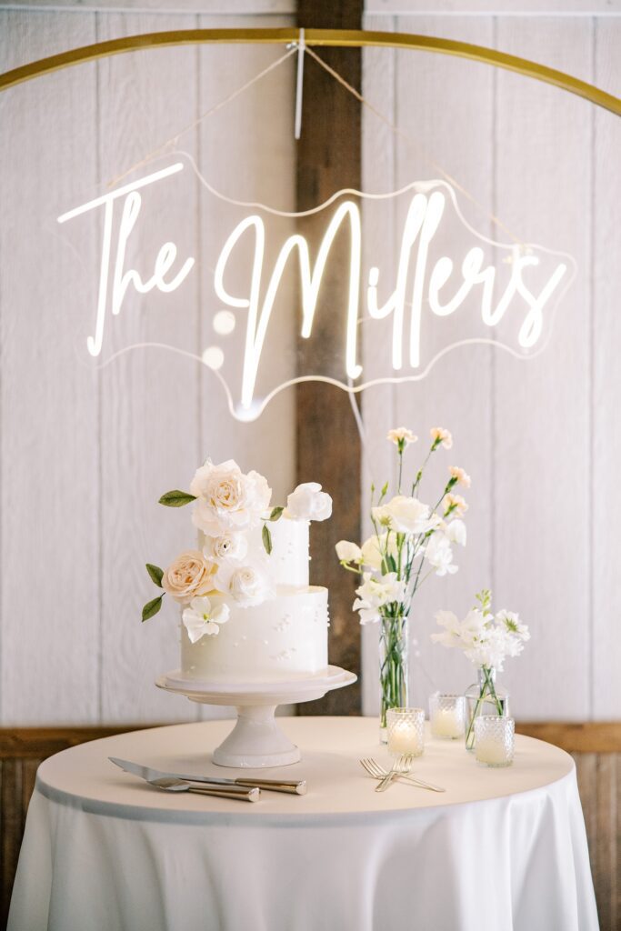 Neon sign above wedding cake at Lamoure Vineyard wedding by Pismo Beach wedding photographer Austyn Elizabeth Photography