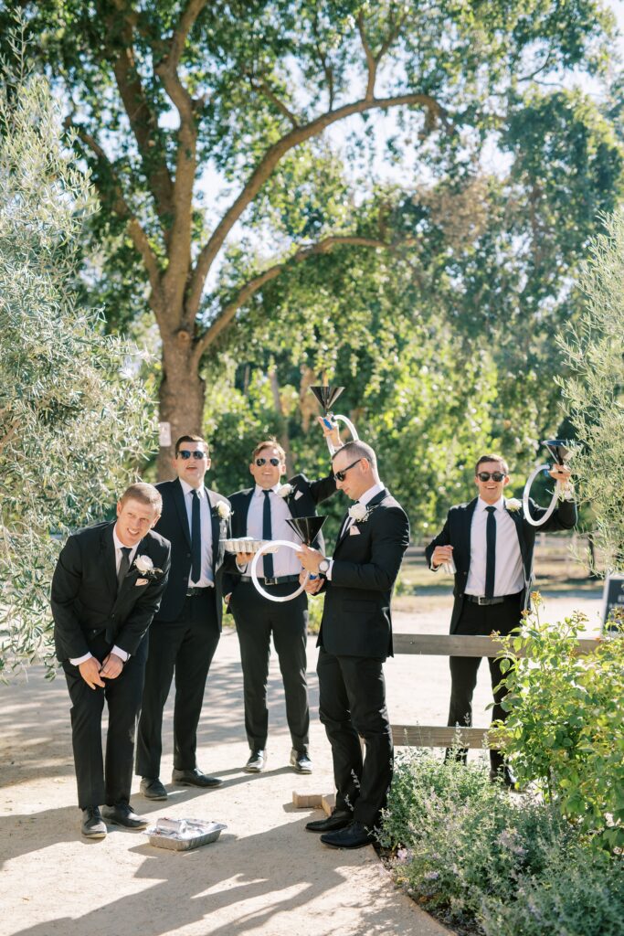 Groomsmen's grand entrance at Lamoure Vineyard wedding by Pismo Beach wedding photographer Austyn Elizabeth Photography