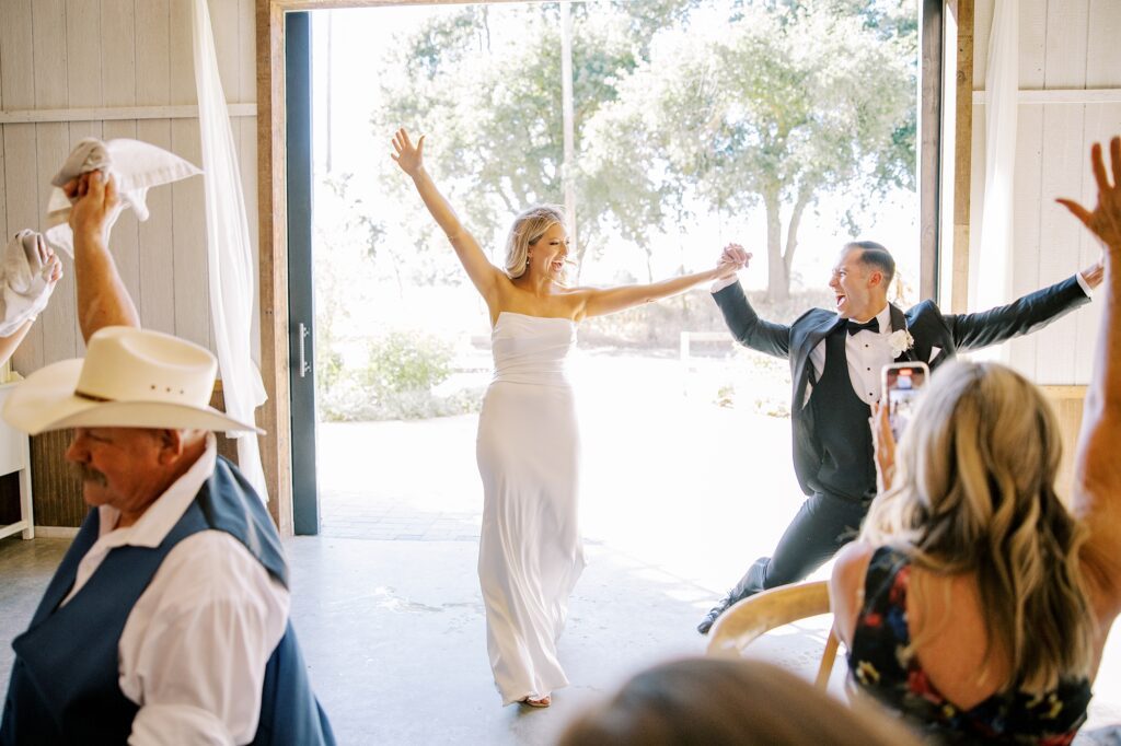 Bride and groom grand enterance at Lamoure Vineyard wedding by Pismo Beach wedding photographer Austyn Elizabeth Photography