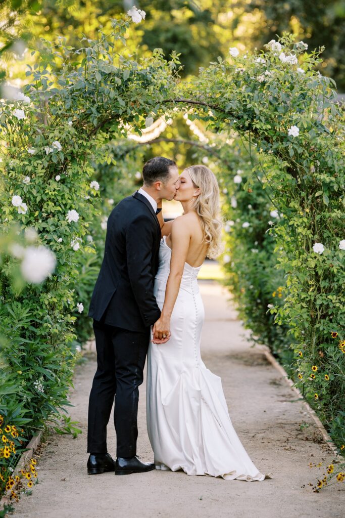 Bride and groom in the arches of garden at Lamoure Vineyard wedding by San Luis Obispo wedding photographer Austyn Elizabeth Photography