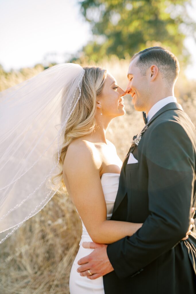 Couple embrace at Lamoure Vineyard wedding by San Luis Obispo wedding photographer Austyn Elizabeth Photography