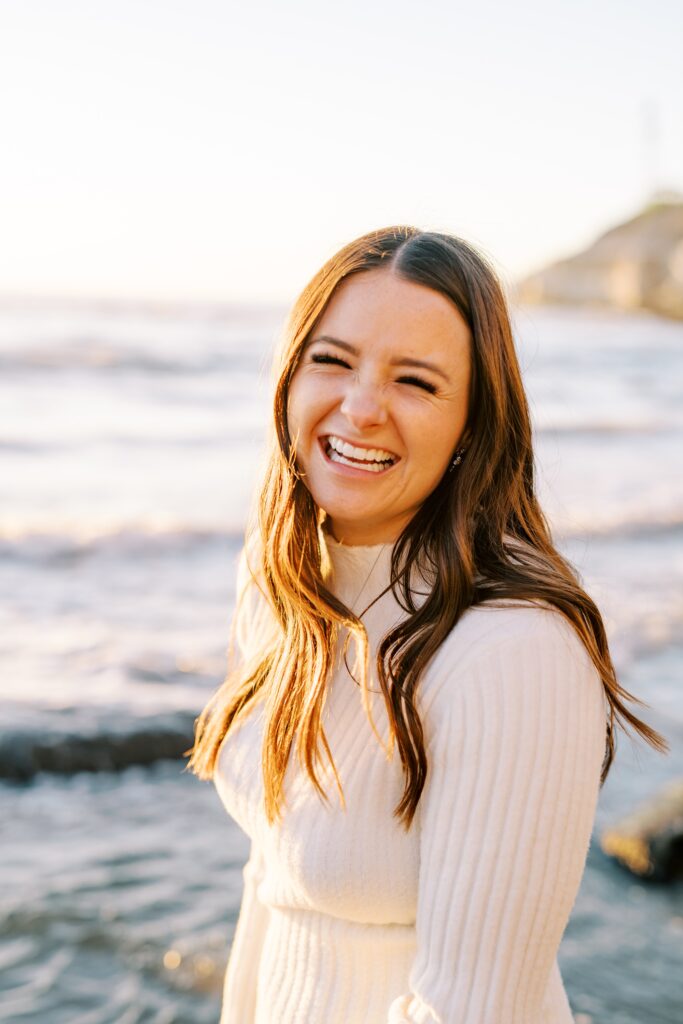 Woman smiles at Pismo Beach Engagement session by Pismo Beach Engagement Photographer Austyn Elizabeth Photography