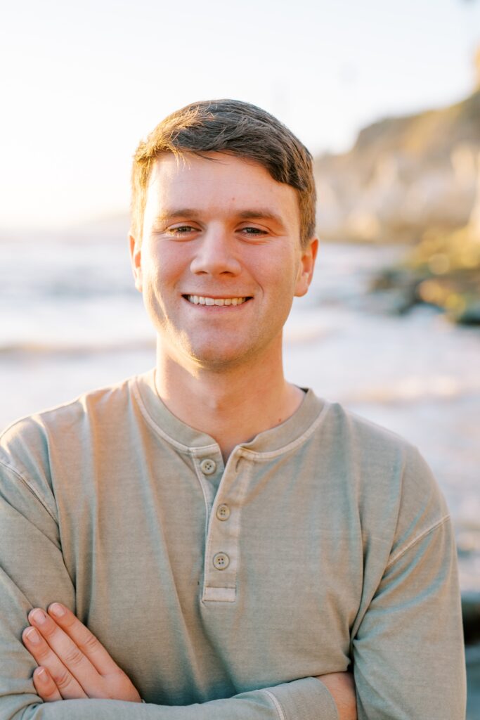 Guy smiles at camera at Pismo Beach Engagement session by Pismo Beach Engagement Photographer Austyn Elizabeth Photography