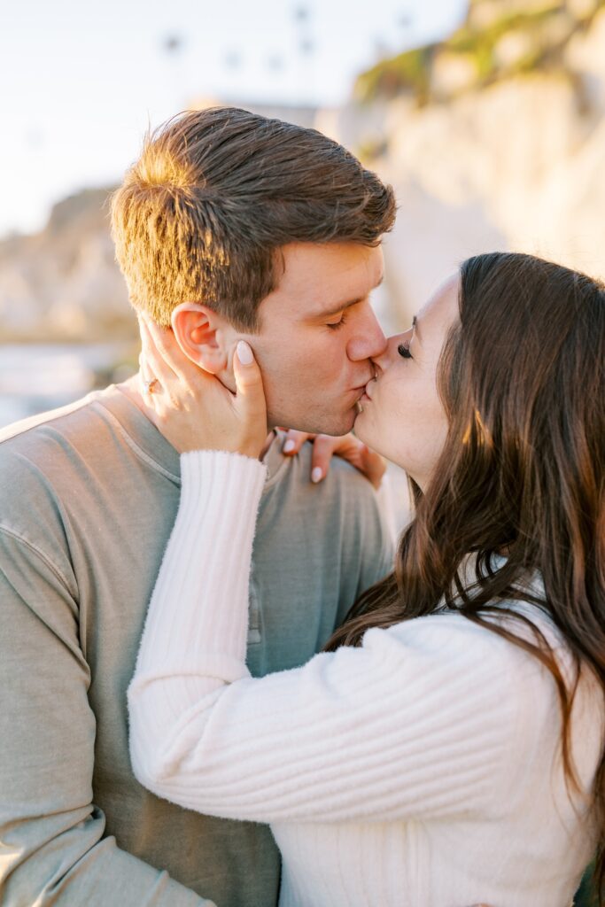 Girlfriend and boyfriend kiss at Pismo Beach Engagement session by Pismo Beach Engagement Photographer Austyn Elizabeth Photography