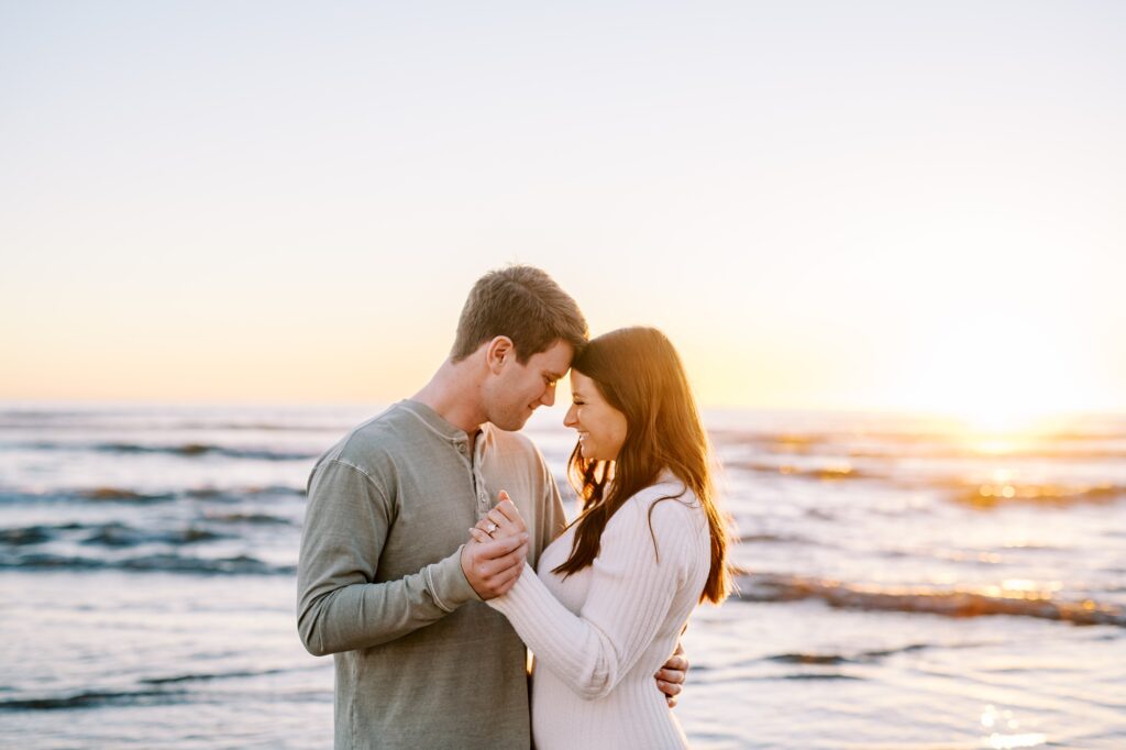Couple dance during golden hour at sunset at Pismo Beach Engagement session by Pismo Beach Wedding Photographer Austyn Elizabeth Photography