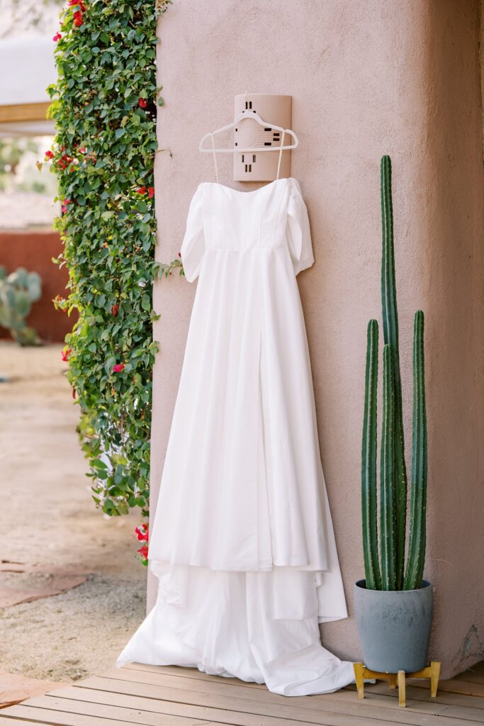 Bride's off the shoulder and high slit wedding dress for pregnant bride at Villa Leche wedding by Palm Springs Wedding Photographer Austyn Elizabeth Photography