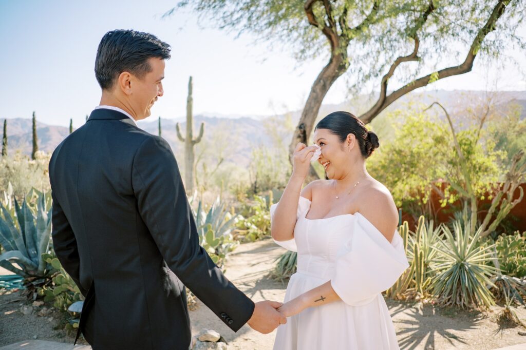 Bride and grooms first look in cactus garden at hawaiian wedding at Villa Leche wedding by Palm Springs Wedding Photographer Austyn Elizabeth Photography