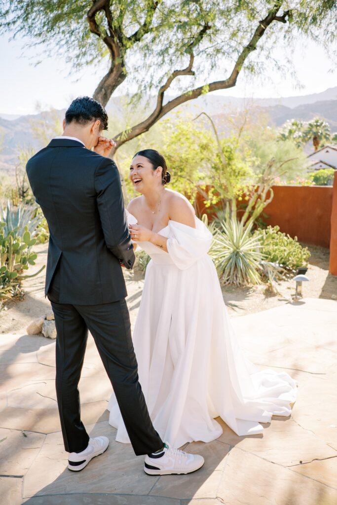 Groom wiping his eyes during first look at Villa Leche wedding by Palm Springs Wedding Photographer Austyn Elizabeth Photography