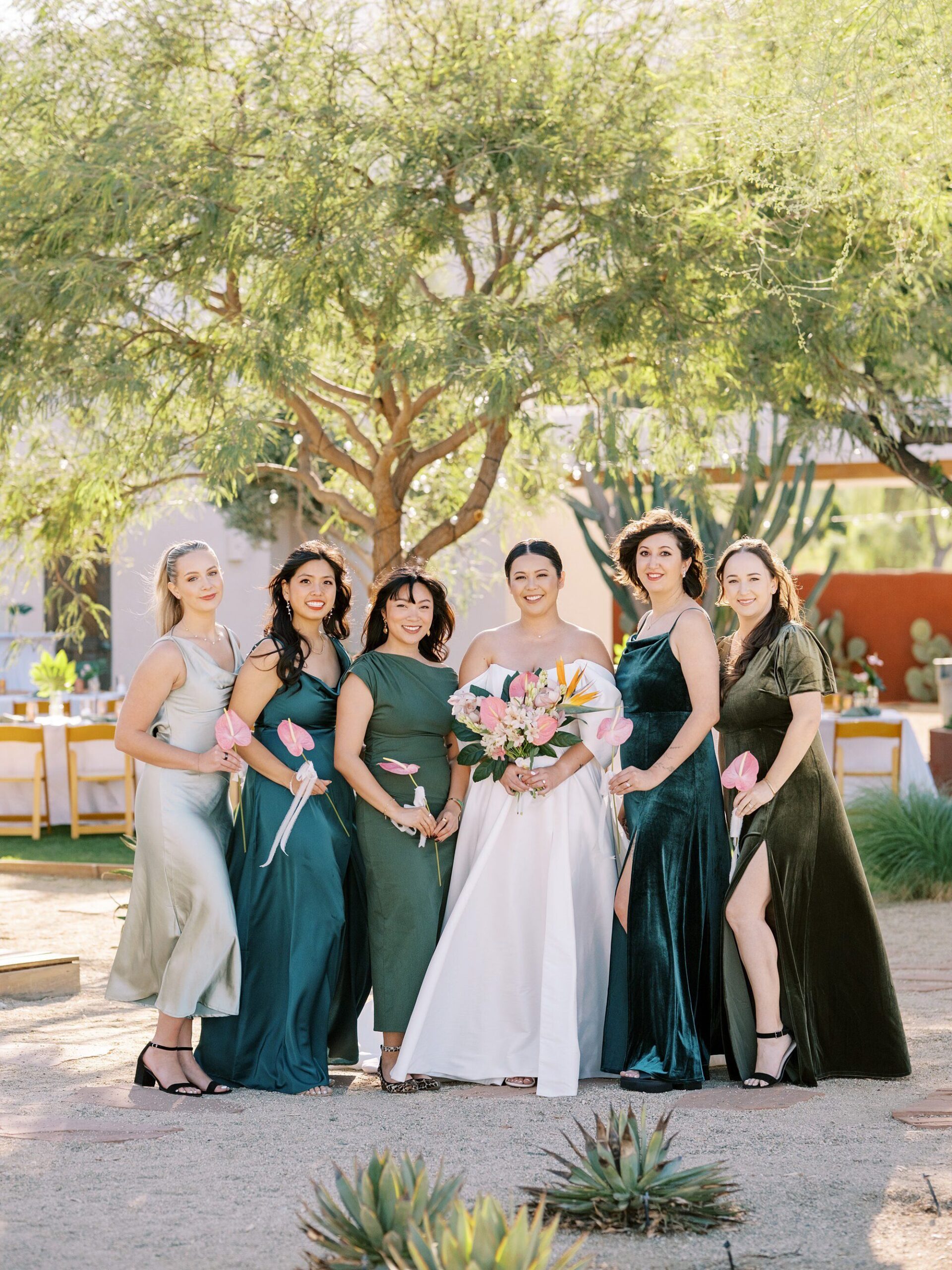 Bride and bridesmaids in teals and green bridesmaids dresses at Villa Leche wedding by Palm Springs Wedding Photographer Austyn Elizabeth Photography