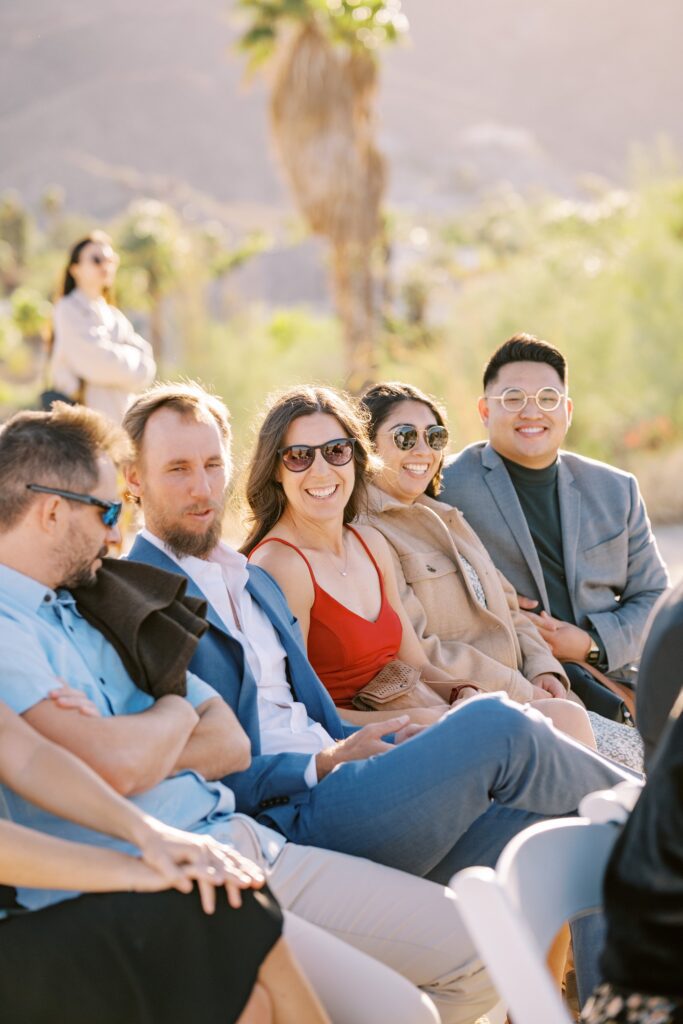 Guests laugh at Villa Leche wedding by Palm Springs Wedding Photographer Austyn Elizabeth Photography