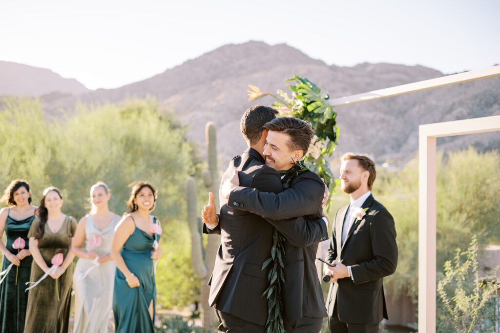 Groom hugs groomsmen before wedding ceremony at Villa Leche wedding by Palm Springs Wedding Photographer Austyn Elizabeth Photography