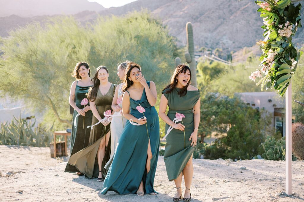 Bridesmaids laugh during wedding ceremony at Villa Leche wedding by Palm Springs Wedding Photographer Austyn Elizabeth Photography