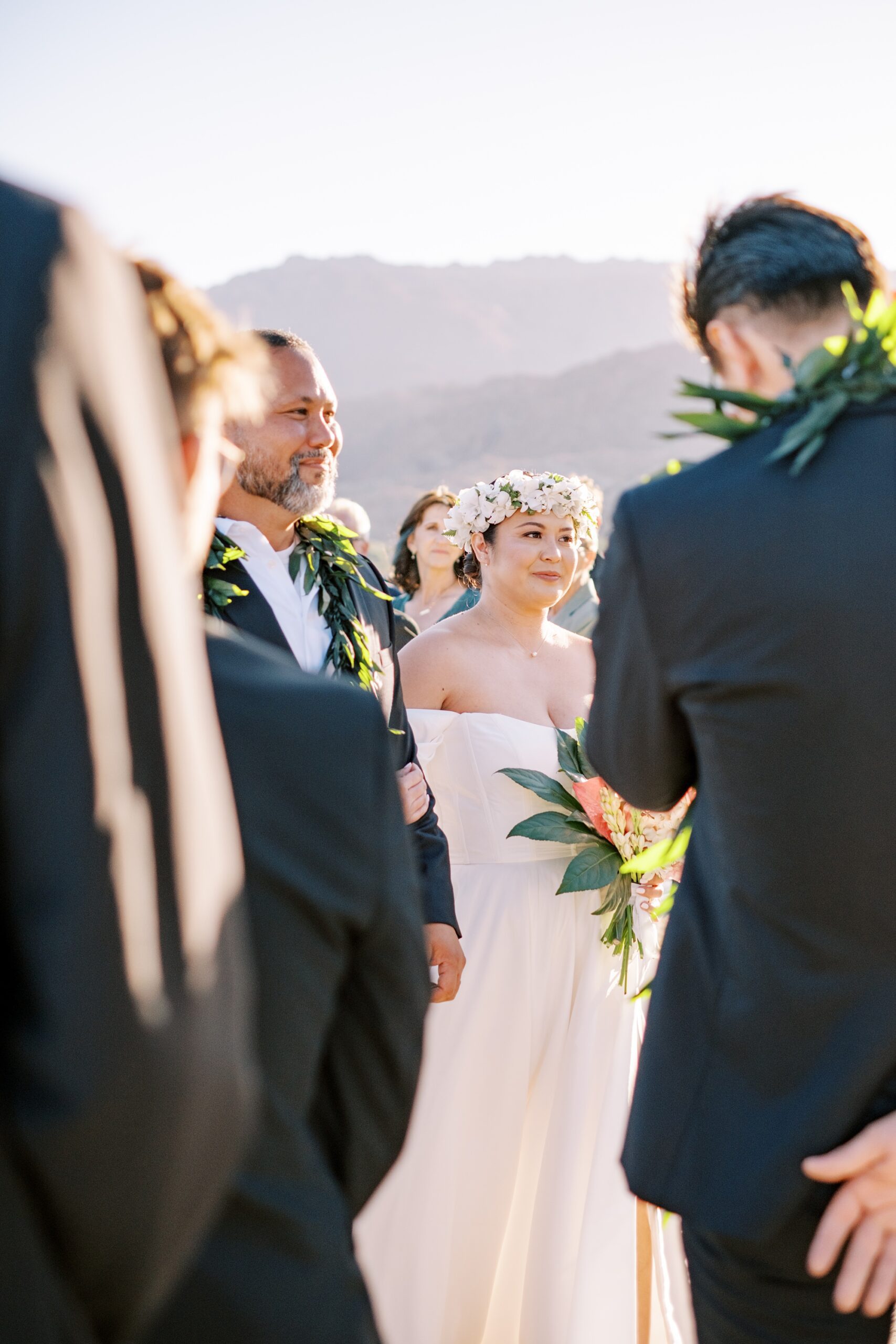 Bride in floral Hawaiian wedding crown during Palm Desert wedding at Villa Leche wedding by Palm Springs Wedding Photographer Austyn Elizabeth Photography