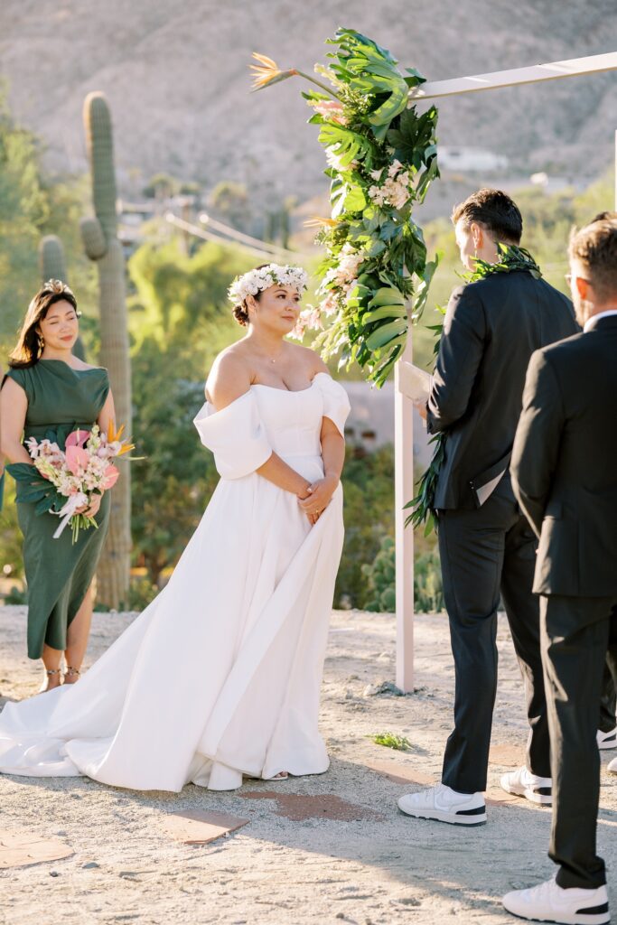 Bride in white hawaiian floral crown and off the sleves dress at Villa Leche wedding by Palm Springs Wedding Photographer Austyn Elizabeth Photography