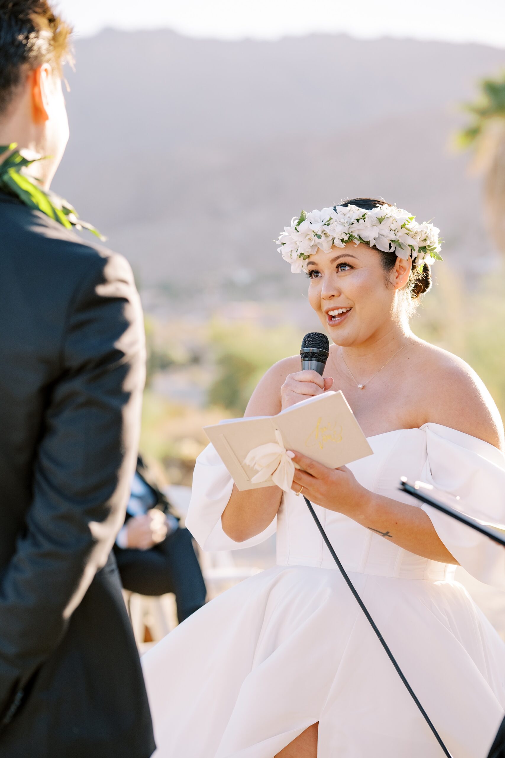 Hawaiian bride with hawaiian floral crown reads vows to groom at hawaiian Palm Springs wedding at Villa Leche wedding by Palm Springs Wedding Photographer Austyn Elizabeth Photography