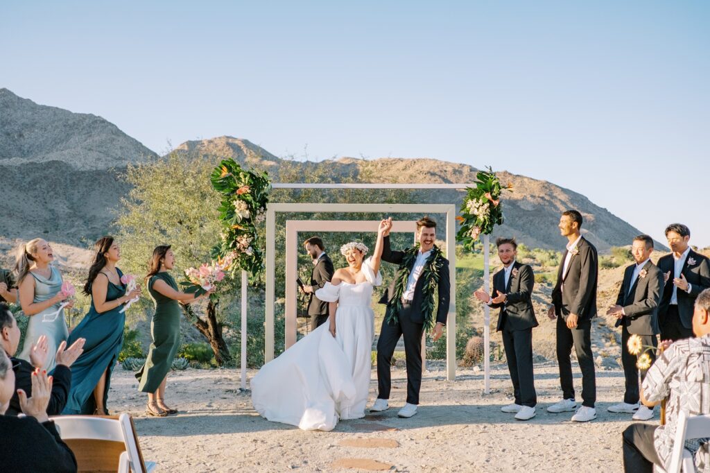 Everyone cheers as pronounced husband and wife at Villa Leche wedding by Palm Springs Wedding Photographer Austyn Elizabeth Photography