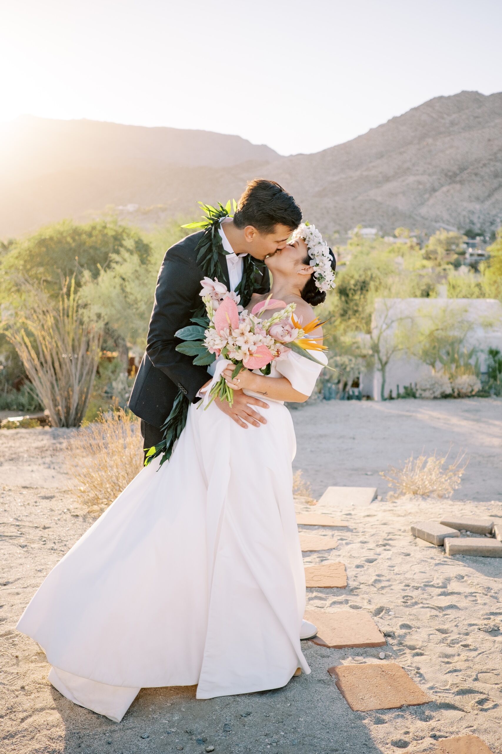 Bride and groom kiss at sunset at Villa Leche wedding by Palm Springs Wedding Photographer Austyn Elizabeth Photography
