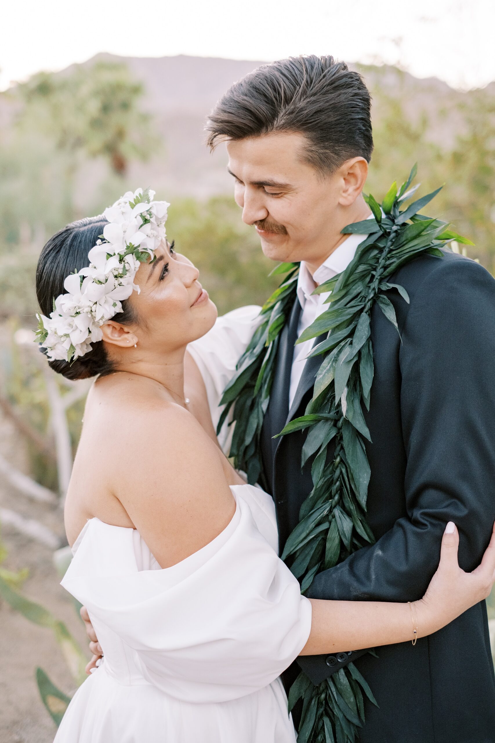 Hawaiian bride looks at groom in the cactus garden at Villa Leche wedding by Palm Springs Wedding Photographer Austyn Elizabeth Photography
