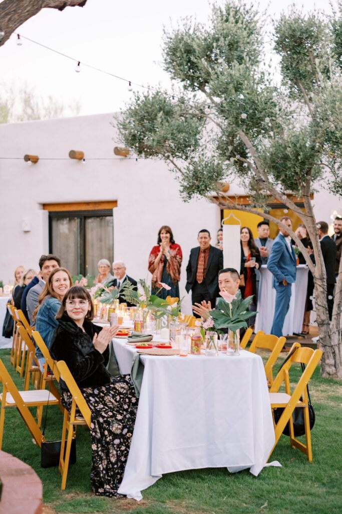 Guests welcome bride and groom into reception at Villa Leche wedding by Palm Springs Wedding Photographer Austyn Elizabeth Photography