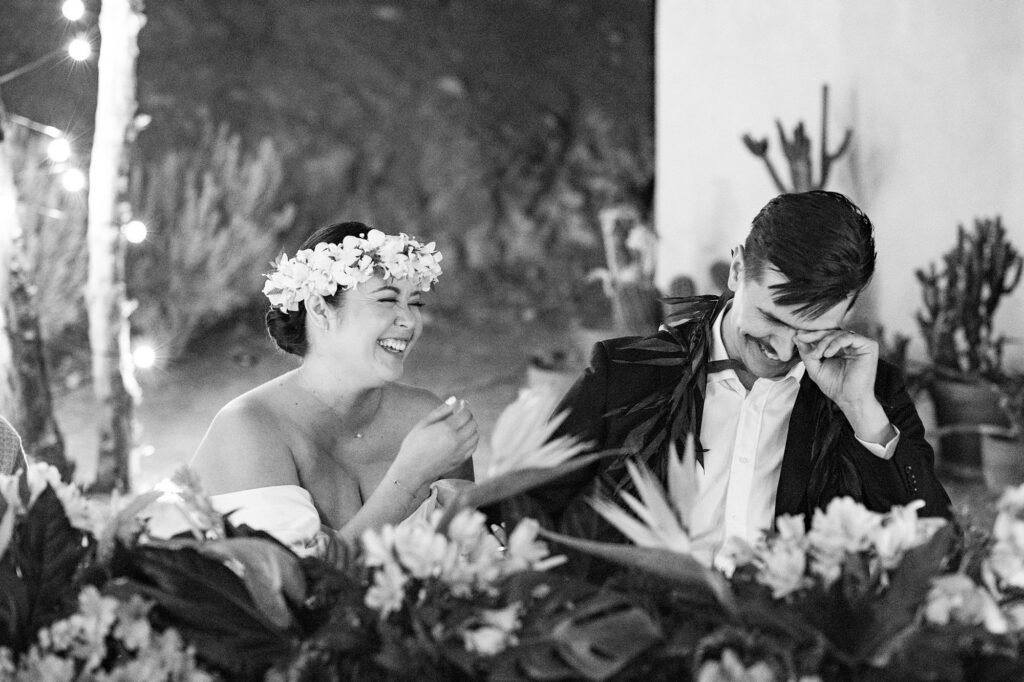 Couple laugh during dinner and toasts at Villa Leche wedding by Palm Springs Wedding Photographer Austyn Elizabeth Photography