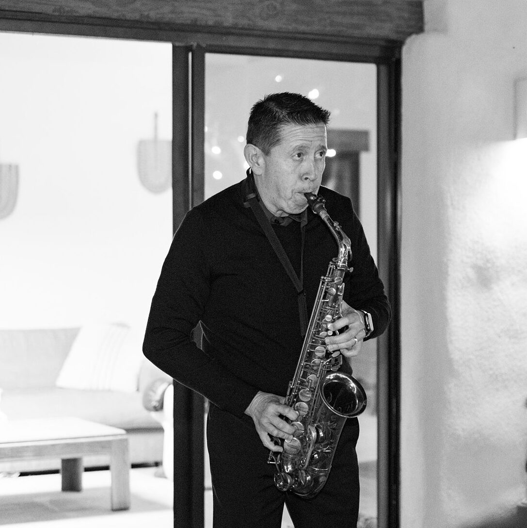 Grooms dad plays saxiphone as a surprise during mother son dance at Villa Leche wedding by Palm Springs Wedding Photographer Austyn Elizabeth Photography