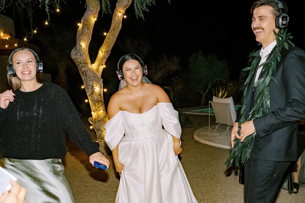 Couple do silent disco at Villa Leche wedding by Palm Springs Wedding Photographer Austyn Elizabeth Photography