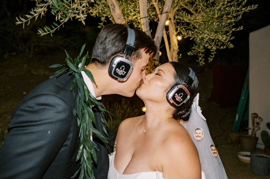 Couple kisses at silent disco at Villa Leche wedding by Palm Springs Wedding Photographer Austyn Elizabeth Photography