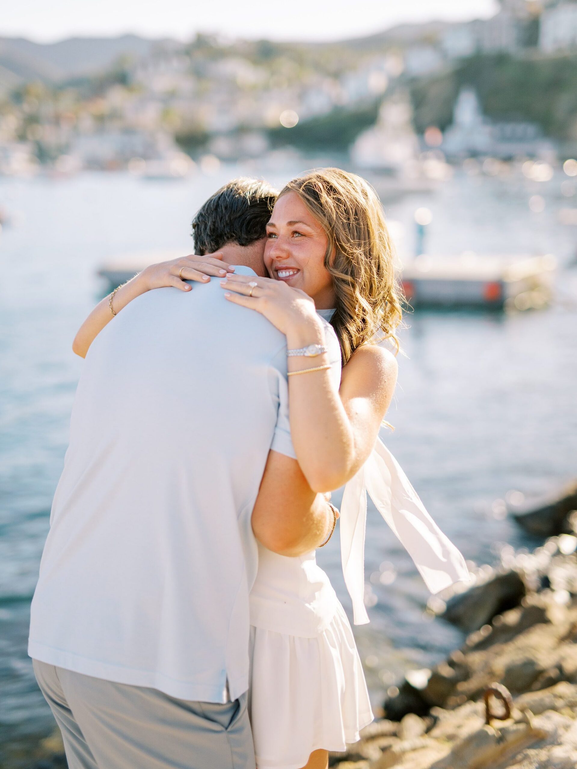 Couple hug during surprise catalina island proposal by catalina island wedding photographer Austyn Elizabeth