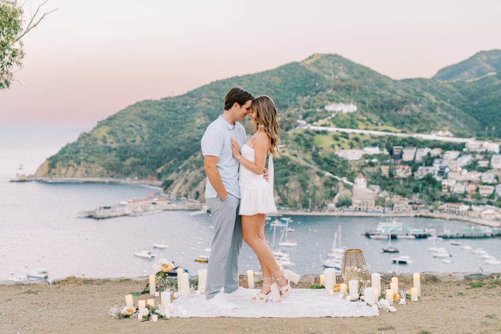 Couple stand during sunset at Lee's Scenic Overlook after surprise proposal with the help of the best Catalina Island Engagement and Proposal Photographer Austyn Elizabeth