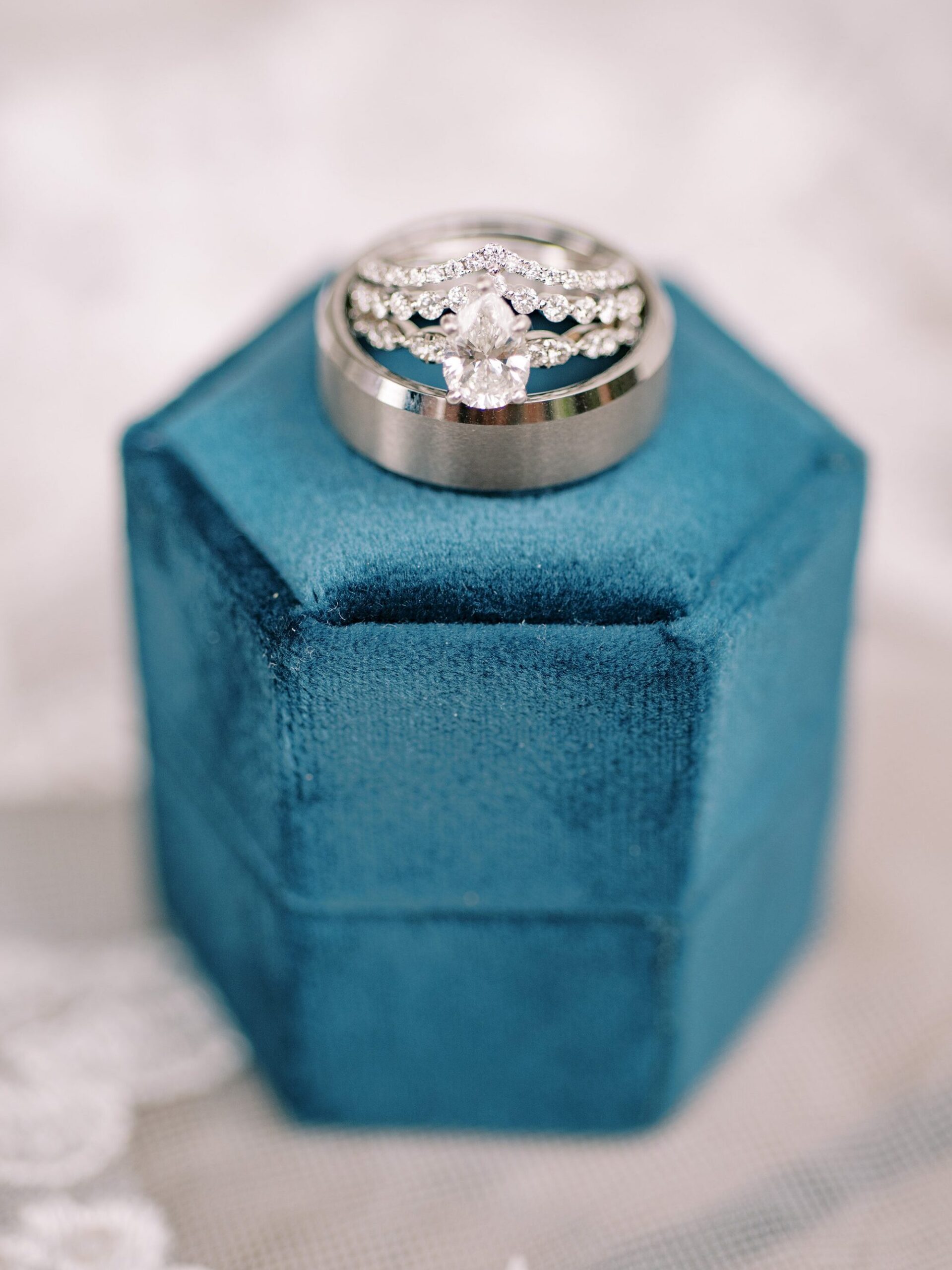 Four generation wedding band on blue velvet box by Cayucos Wedding Photographer on Film by Austyn Elizabeth Photography