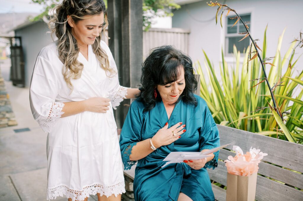 Grooms mom crying when reading card from the bride by Cayucos Wedding Photographer on Film by Austyn Elizabeth Photography