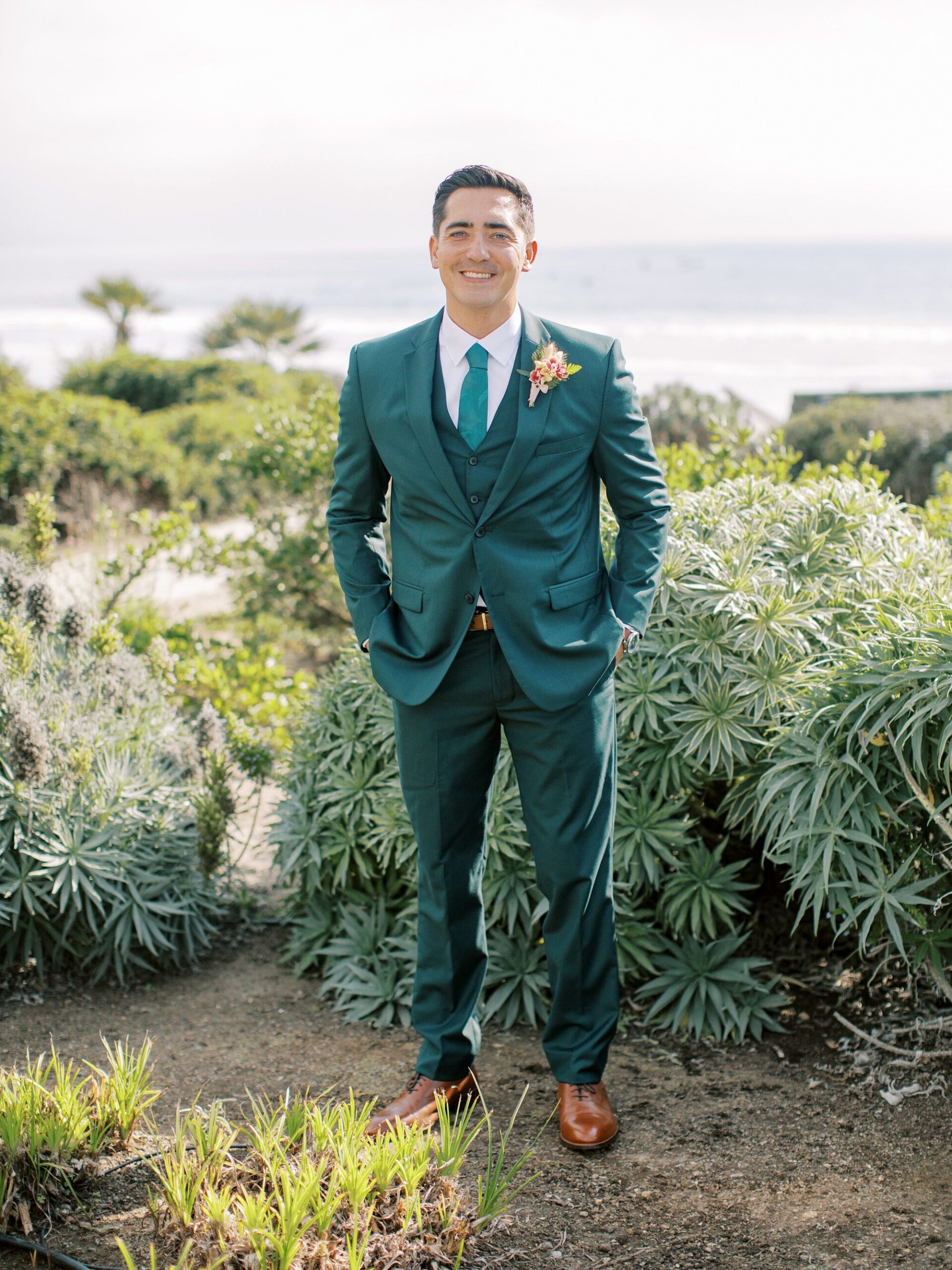 Groom in teal green suite by Cayucos Wedding Photographer on Film by Austyn Elizabeth Photography