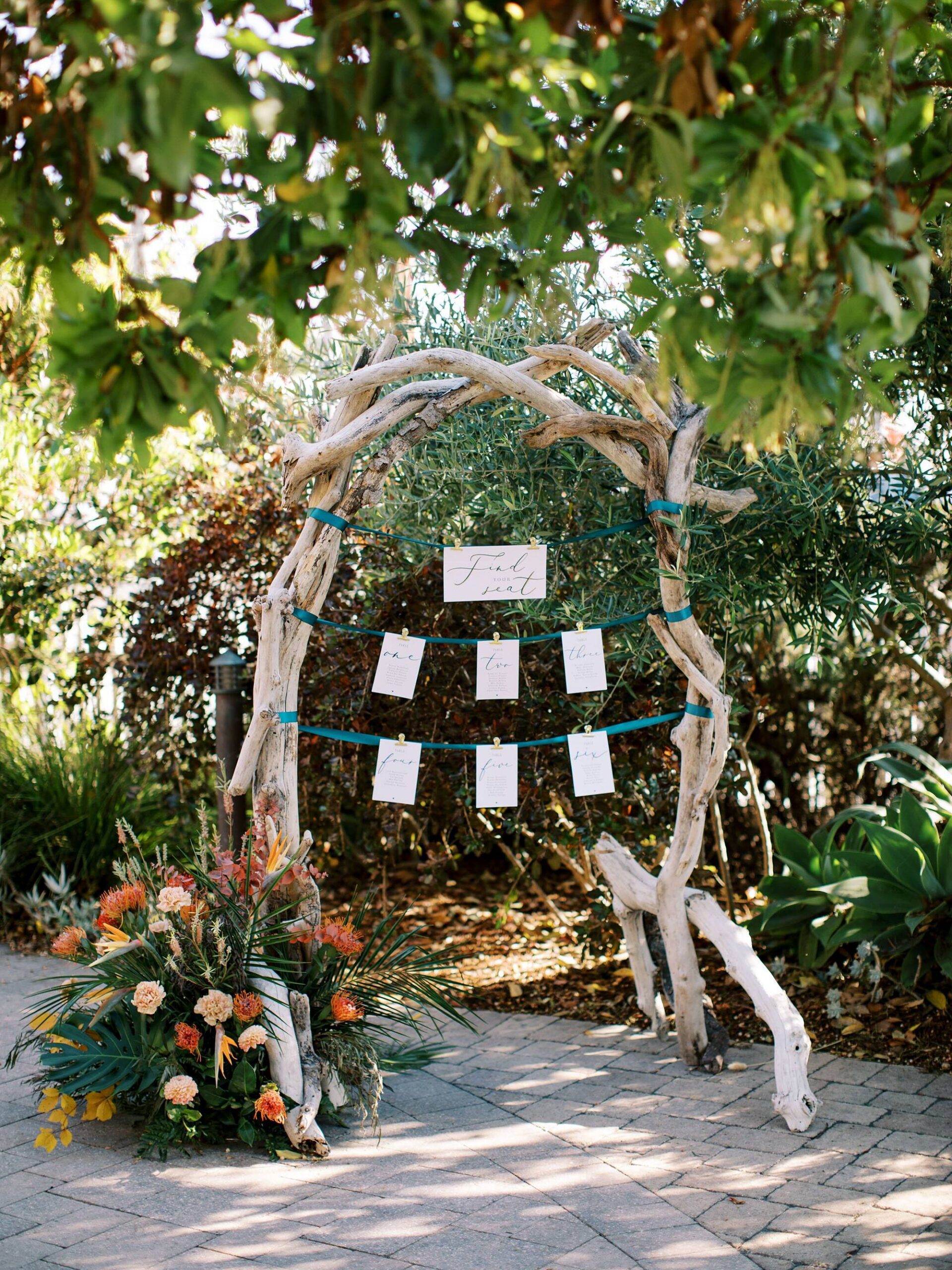 Seating displays with drift wood and scripts for tropical island inspired wedding by Cayucos Wedding Photographer on Film by Austyn Elizabeth Photography