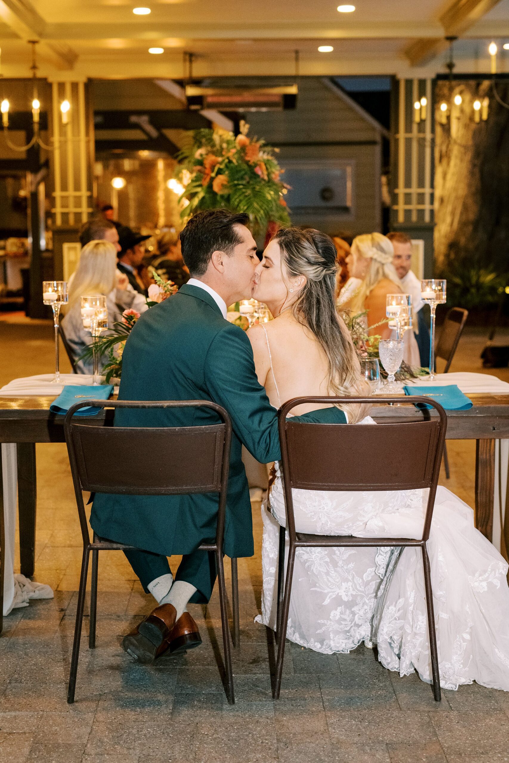 Couple kisses during reception by Cayucos Wedding Photographer on Film by Austyn Elizabeth Photography