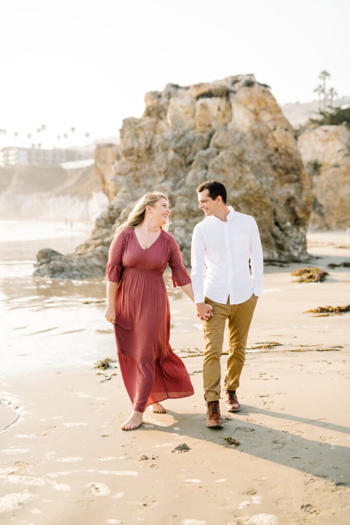 Walking hand in hand by Pismo Beach Engagement Photographer Austyn Elizabeth Photography