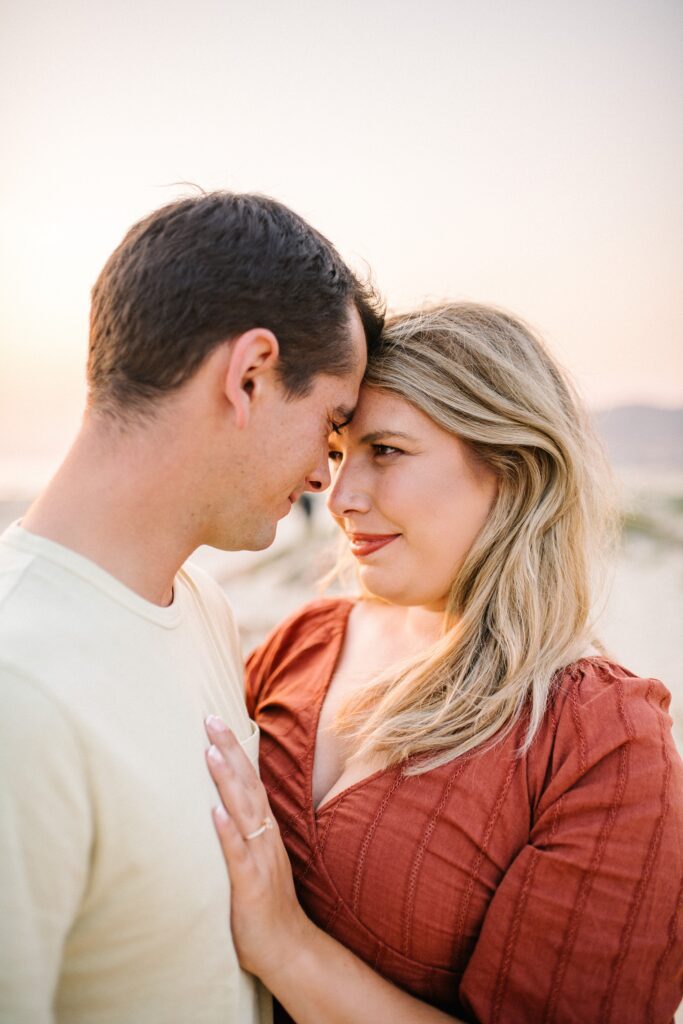 Couple look romantically into each other's eyes by Pismo Beach Engagement Photographer Austyn Elizabeth Photography