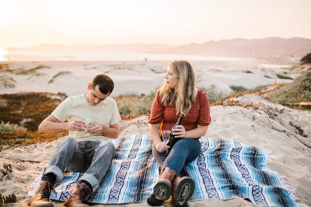 Opening champagne by Pismo Beach Engagement Photographer Austyn Elizabeth Photography