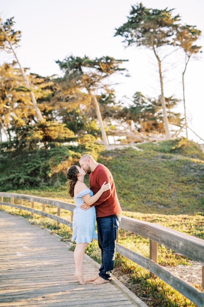 Couple kisses on the board walk at pismo beach dunes for their Pismo Beach Anniversary by Pismo Beach Anniversary Photographer Austyn Elizabeth Photography