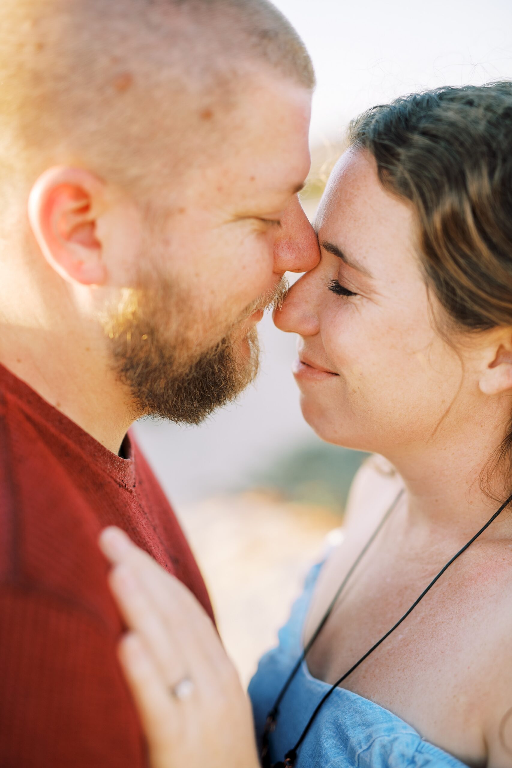 Couple get close and embrace at pismo beach dunes for their Pismo Beach Anniversary by Pismo Beach Anniversary Photographer Austyn Elizabeth Photography